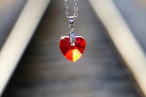 red heart medallion, love symbol, lost love