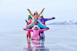 Two Women with Children Posing Together on Ice