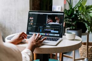 Person Using Macbook Pro on White Table